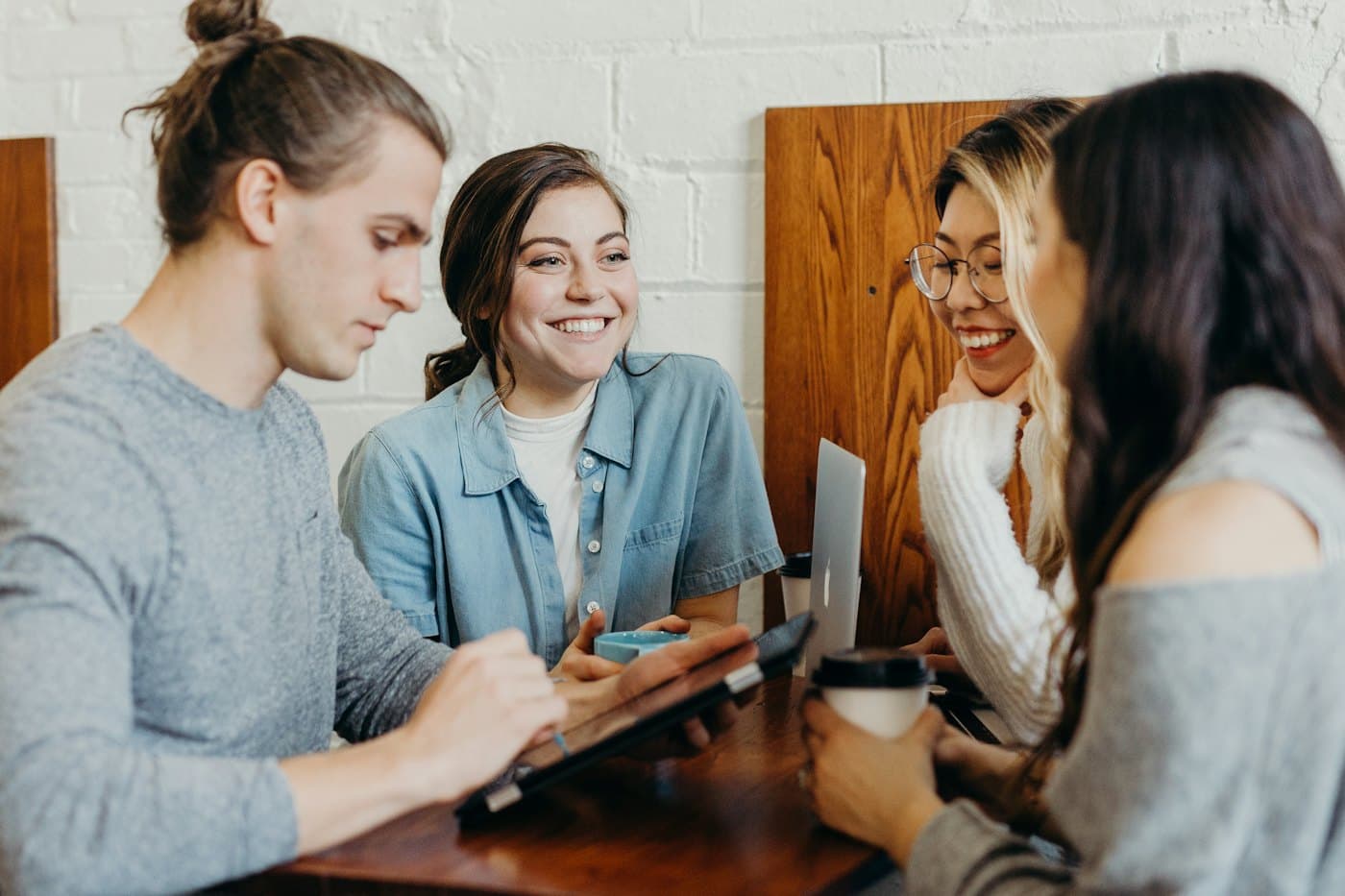 Friends chatting and laughing in a café